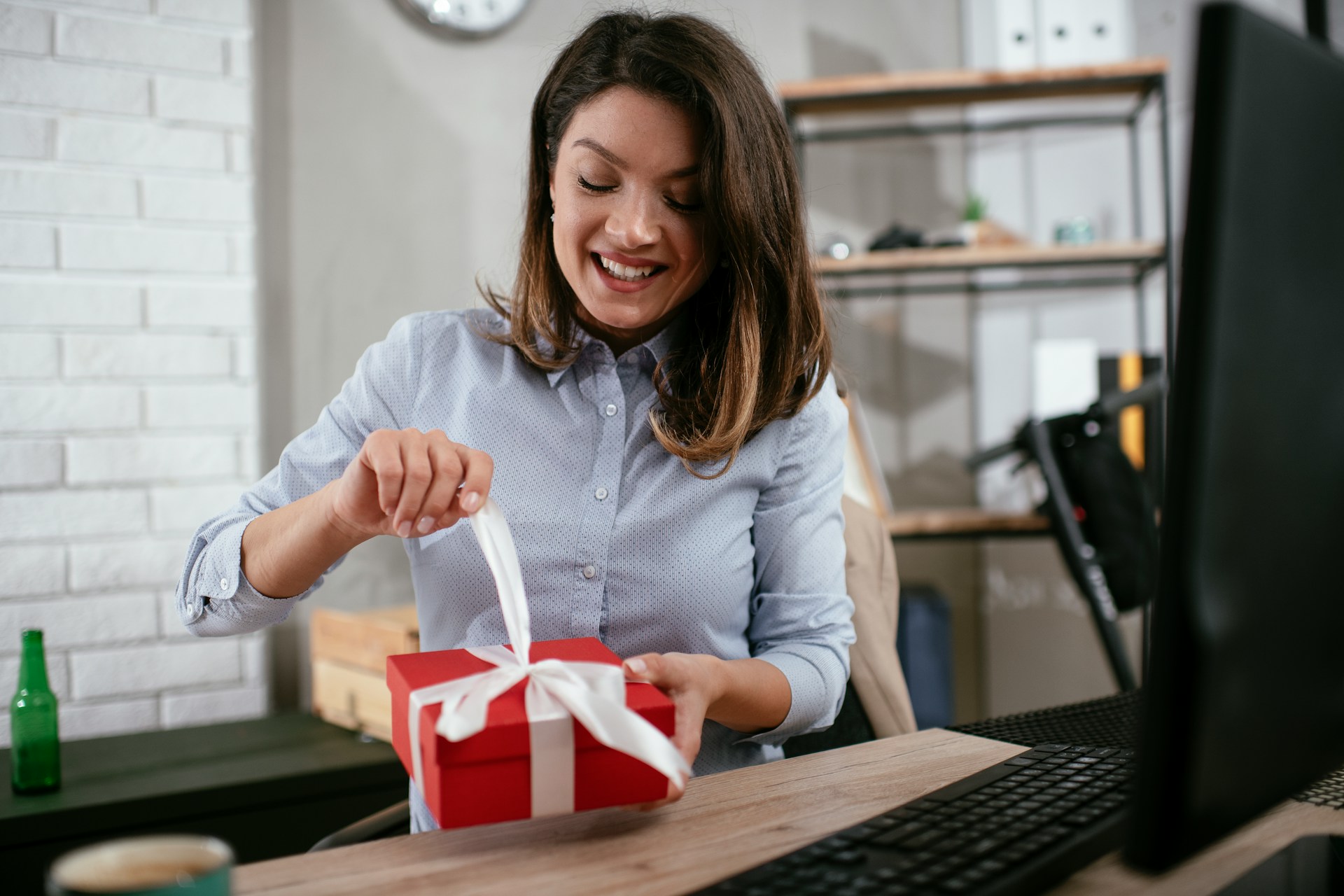 woman receiving a gift at work